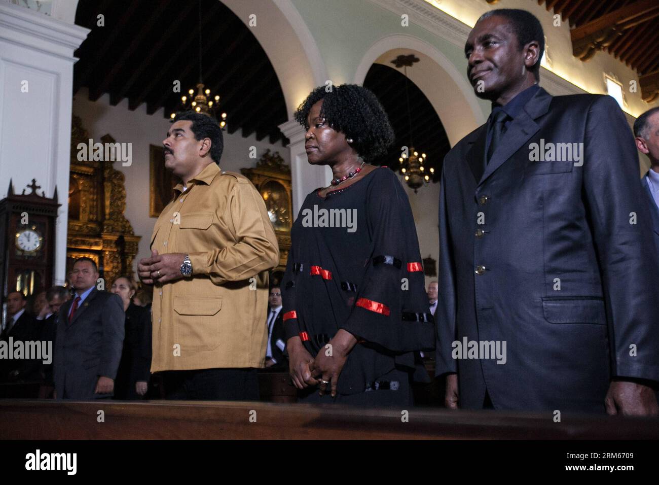 Bildnummer: 60829160  Datum: 13.12.2013  Copyright: imago/Xinhua     (131213) -- CARACAS, Dec. 13, 2013 (Xinhua) -- Venezuelan President Nicolas Maduro (L) and South African ambassador to Venezuela Thaninga Shope Linney (2nd R) take part in the mass of honor for the late former South African President Nelson Mandela at the San Francisco de Asis Church, in Caracas, capital of Venezuela, on Dec. 13, 2013. (Xinhua/Boris Vergara) VENEZUELA-CARACAS-POLITICS-MANDELA PUBLICATIONxNOTxINxCHN People Politik Gesellschaft Trauer Gedenken Trauerfeier RSA Südafrika xdp x0x 2013 quer premiumd Stock Photo