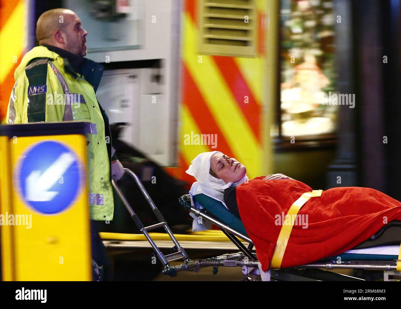 Injured woman on stretcher hi-res stock photography and images - Alamy