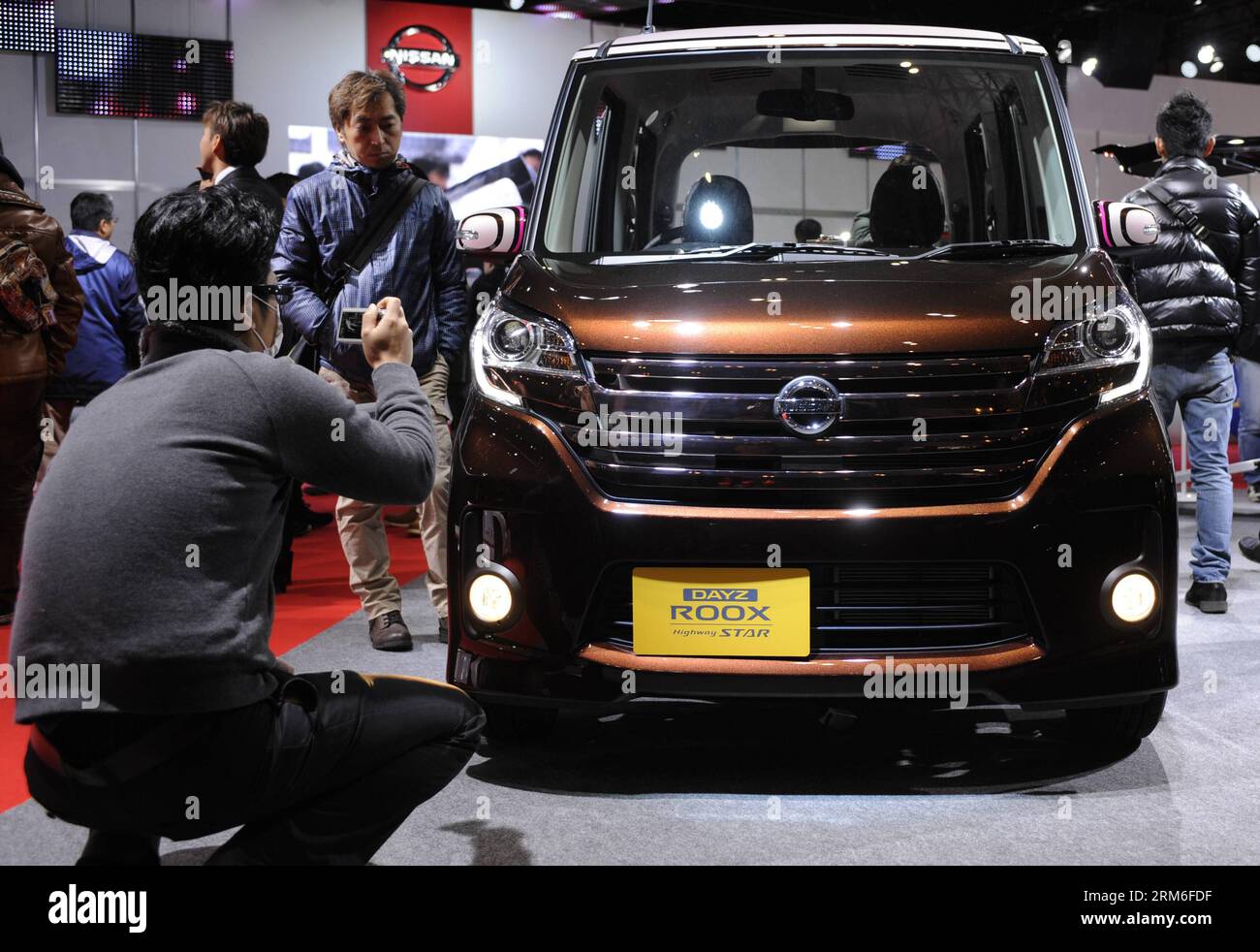 People look at Nissan s Dayz Roox at Tokyo Auto Salon 2014 in Chiba, Japan, Jan. 10, 2014. Some 400 companies participated in the 3-day event, which was held until Jan. 12. (Xinhua/Stringer) JAPAN-TOKYO AUTO SALON 2014-EVENT PUBLICATIONxNOTxINxCHN   Celebrities Look AT Nissan S   AT Tokyo Car Salon 2014 in Chiba Japan Jan 10 2014 Some 400 Companies participated in The 3 Day Event Which what Hero Until Jan 12 XINHUA Stringer Japan Tokyo Car Salon 2014 Event PUBLICATIONxNOTxINxCHN Stock Photo