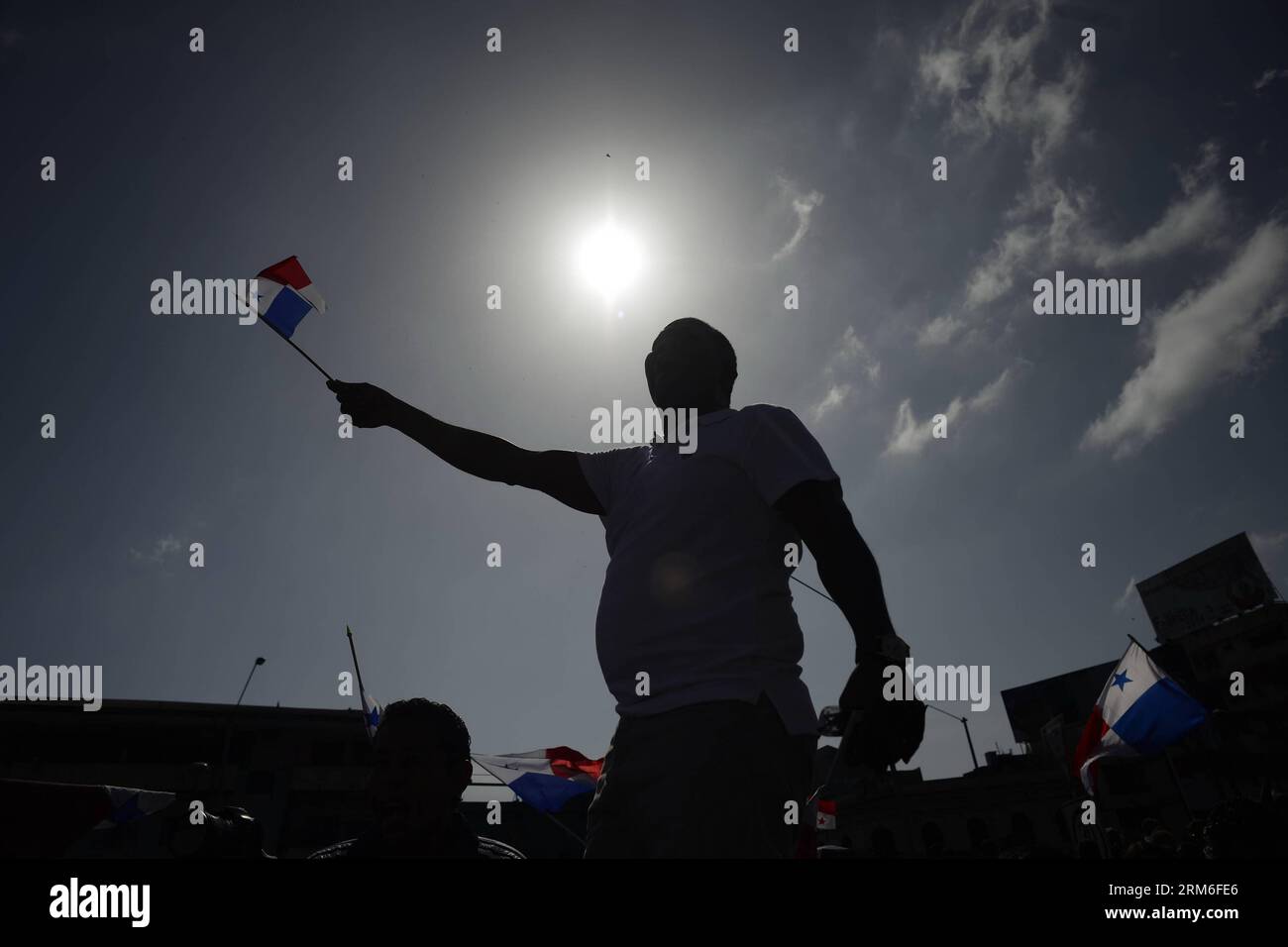 A man waves a Panamanian flag during the commemoration of the Martyrs Day, in Panama City, capital of Panama, on Jan. 9, 2014. The Martyrs Day was a movement occurred in Panama on Jan. 9, 1964, when troops of the U.S. Army clashed with high school students who demanded the right to raise the national flag in the area known as Canal Zone, a strip of land around the Panama Canal, which was ceded to the United States of America in perpetuity as a result of the Hay-Bunau-Varilla Treaty. (Xinhua/Mauricio Valenzuela) PANAMA-PANAMA CITY-MARTYRS DAY-COMMEMORATION PUBLICATIONxNOTxINxCHN   a Man Waves a Stock Photo