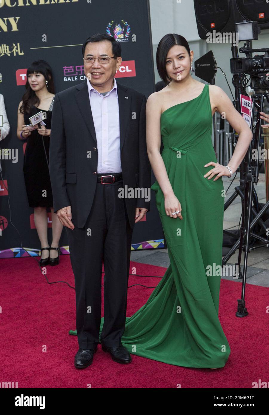 (140111) -- LOS ANGELES, Jan. 10, 2014 (Xinhua) -- Li Dongsheng (L), TCL chairman and CEO, and actress Michelle Chen arrive for the Hollywood TCL Microcinema Award Ceremony at TCL Chinese Theater in Los Angeles, the United States, Jan. 10, 2014. (Xinhua/Zhao Hanrong) U.S.-LOS ANGELES-MICROCINEMA AWARD PUBLICATIONxNOTxINxCHN   Los Angeles Jan 10 2014 XINHUA left Dongsheng l TCL Chairman and CEO and actress Michelle Chen Arrive for The Hollywood TCL  Award Ceremony AT TCL Chinese Theatre in Los Angeles The United States Jan 10 2014 XINHUA Zhao  U S Los Angeles  Award PUBLICATIONxNOTxINxCHN Stock Photo