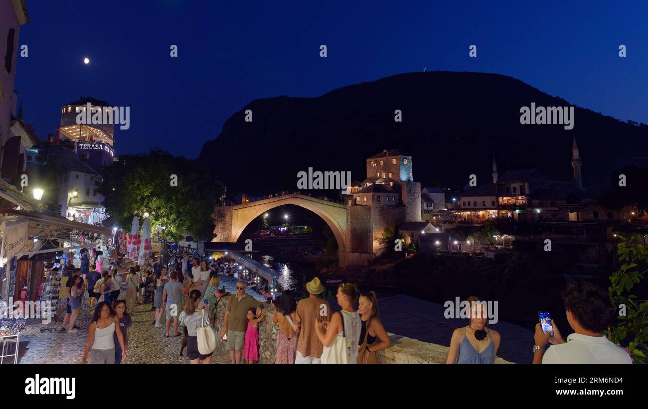 Mostar old Town and Unesco Site on a summers night full of tourists. with Stari Most (Old Bridge) behind. Bosnia and Herzegovina, August 26, 2023. Stock Photo