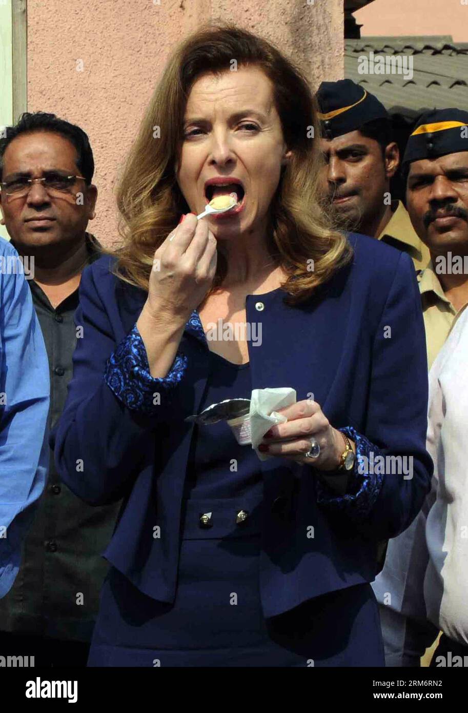 (140127) -- MUMBAI, Jan. 27, 2014 (Xinhua) -- Valerie Trierweiler (front), the ex-first lady of French President Francois Hollande, eats malnutrition formula at Nutrition Rehabilitation and Research Center at Dharavi slum in Mumbai, India, Jan. 27, 2014. A day after splitting up with Hollande, Trierweiler launched a new stage in her life Sunday with a charity visit to India. (Xinhua/Stringer) INDIA-MUMBAI-FRANCE-VALERIE TRIERWEILER PUBLICATIONxNOTxINxCHN   Mumbai Jan 27 2014 XINHUA Valerie Trierweiler Front The Ex First Lady of French President François Hollande eats malnutrition Formula AT Nu Stock Photo