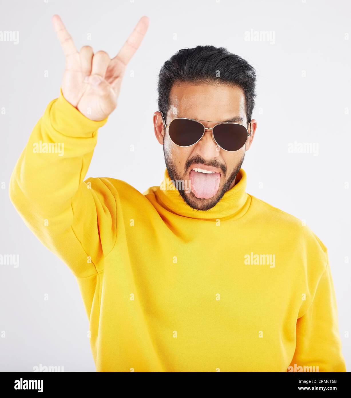 Man, horns and hand with sunglasses, studio portrait and rock icon for ...