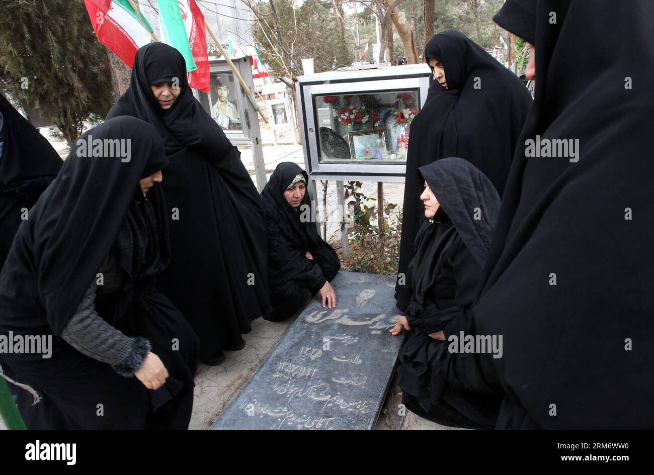 TEHRAN, (Xinhua) -- Iranian women visit the graves of people who were killed during the 1979 Islamic revolution at the Behesht-e Zahra cemetery outside Tehran, Iran, on Feb. 1, 2014, to mark the 35th anniversary of the Islamic revolution. (Xinhua/AhmadHalabisaz) IRAN-TEHRAN-ISLAMIC REVOLUTION-ANNIVERSARY-CEMETERY PUBLICATIONxNOTxINxCHN   TEHRAN XINHUA Iranian Women Visit The Graves of Celebrities Who Were KILLED during The 1979 Islamic Revolution AT The Behesht e Zahra Cemetery outside TEHRAN Iran ON Feb 1 2014 to Mark The 35th Anniversary of The Islamic Revolution XINHUA  Iran TEHRAN Islamic Stock Photo