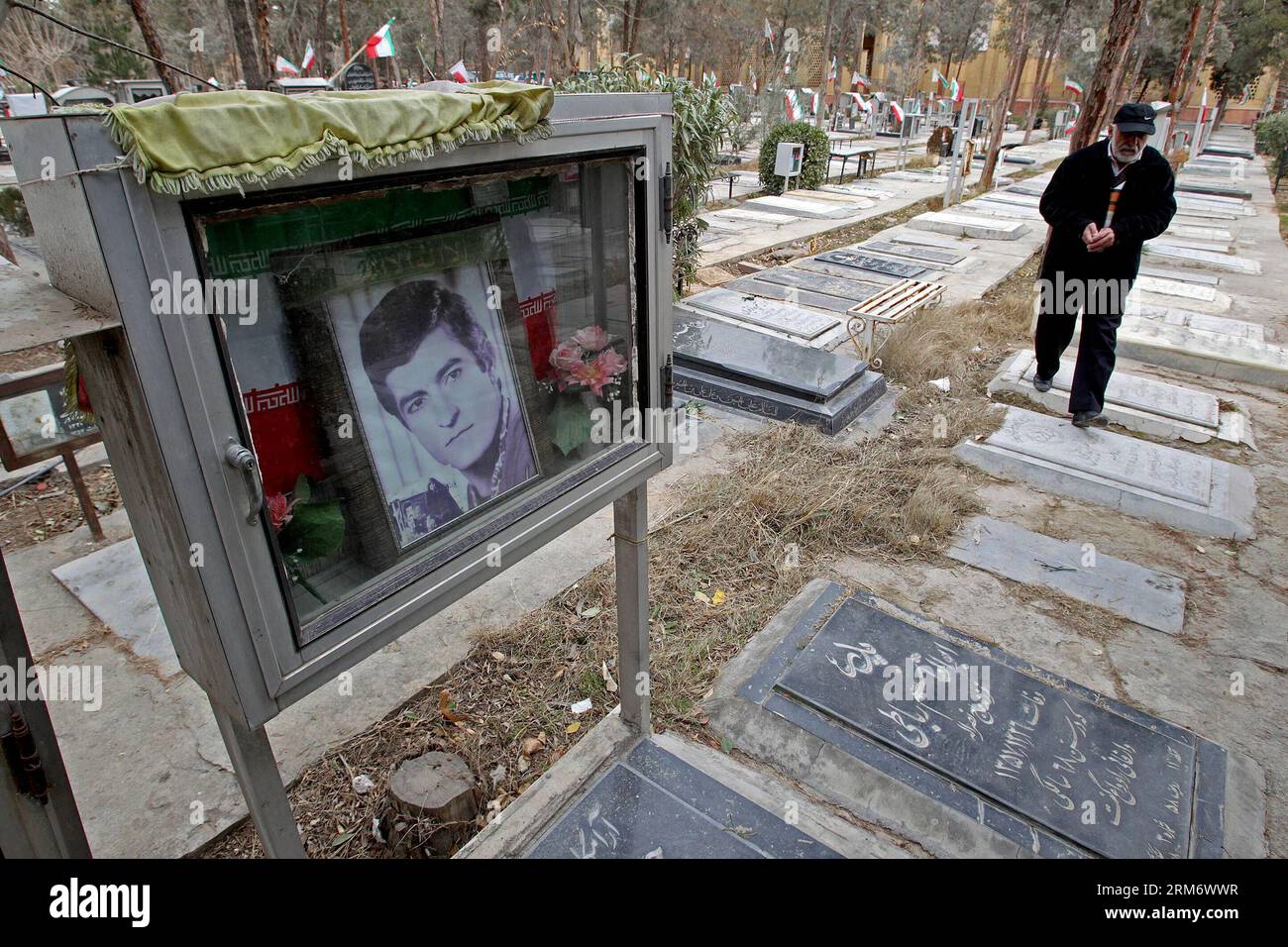 TEHRAN, (Xinhua) -- A man visits the graves of people who were killed during the 1979 Islamic revolution at the Behesht-e Zahra cemetery outside Tehran, Iran, on Feb. 1, 2014, to mark the 35th anniversary of the Islamic revolution. (Xinhua/AhmadHalabisaz) IRAN-TEHRAN-ISLAMIC REVOLUTION-ANNIVERSARY-CEMETERY PUBLICATIONxNOTxINxCHN   TEHRAN XINHUA a Man visits The Graves of Celebrities Who Were KILLED during The 1979 Islamic Revolution AT The Behesht e Zahra Cemetery outside TEHRAN Iran ON Feb 1 2014 to Mark The 35th Anniversary of The Islamic Revolution XINHUA  Iran TEHRAN Islamic Revolution Ann Stock Photo
