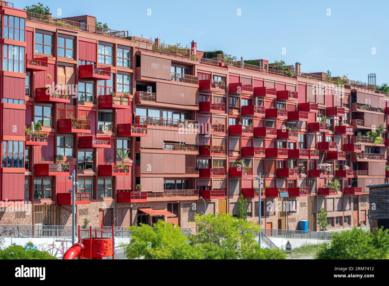 Modern red apartment building seen in Berlin, Germany Stock Photo