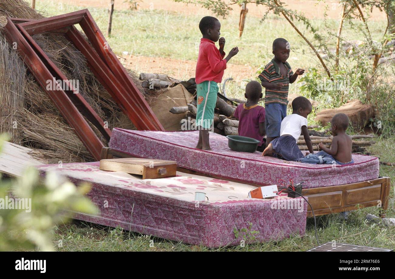 Children play at the flood-ravaged Kushinga school in Chivi, Masvingo province, about 380 km south of Harare, Zimbabwe, Feb. 13, 2014. Zimbabwe on Tuesday appealed for about 20 million U.S. dollars from foreign governments and international aid agencies to evacuate 20,000 villagers near a brimming dam in the country s southeast region. Heavy downpours of this rainy season caught many Zimbabweans off guard. (Xinhua/Stringer) ZIMBABWE-MASVINGO-FLOODS PUBLICATIONxNOTxINxCHN   Children Play AT The Flood ravaged  School in  Masvingo Province About 380 km South of Harare Zimbabwe Feb 13 2014 Zimbabw Stock Photo