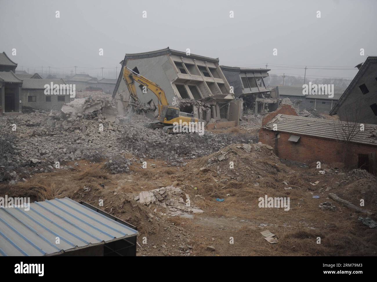 (140220) -- BEIJING, Feb. 20, 2014 (Xinhua) -- An excavator demolishes illegal houses in Zhenggezhuang Village, Beiqijia Township of Changping District on the outskirt of Beijing, China, Feb. 20, 2014. Those illegal houses cover an area of 108.55 mu (about 7.24 hectares) , which will be used for tree planting after complete of demolition. (Xinhua/Luo Xiaoguang) (hdt) CHINA-BEIJING-CHANGPING-ILLEGAL HOUSES-DEMOLITION (CN) PUBLICATIONxNOTxINxCHN   Beijing Feb 20 2014 XINHUA to excavator demolishes illegal Houses in  Village  Township of Chang Ping District ON The outskirts of Beijing China Feb 2 Stock Photo