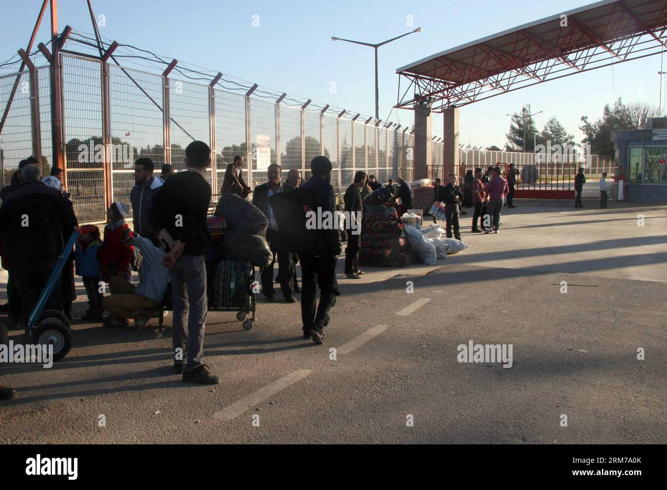 (140220) -- KILIS(TURKEY), Feb. 20, 2014 (Xinhua) -- Syrian refugees wait after an explosion at Syria s Esselame border crossing near the southern Turkish province of Kilis, Feb. 20, 2014. At least 24 people were killed and many others wounded on Thursday in a strong explosion near Syrian- Turkish border in Kilis province in southern Turkey, private Dogan news agency reported. (Xinhua/Mert Macit) TURKEY-KILIS-SYRIAN BORDER-BLAST PUBLICATIONxNOTxINxCHN   Turkey Feb 20 2014 XINHUA Syrian Refugees Wait After to Explosion AT Syria S  Border Crossing Near The Southern Turkish Province of  Feb 20 20 Stock Photo