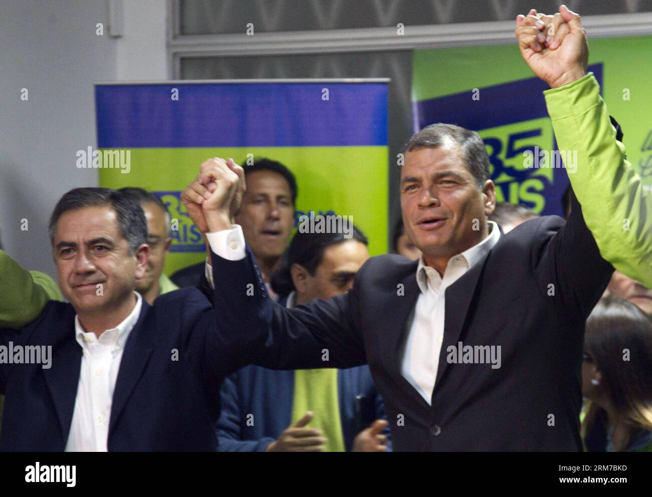 Ecuador s President Rafael Correa (R) and the candidate for the reelection to the Quito s Mayoralty, Augusto Barrera (L), react after receiving the results of the provincial and municipal election, at the headquarters of the Pais Alliance party, in the city of Quito, capital of Ecuador, on Feb. 23, 2014. The opposition candidate Mauricio Rodas won the election for the Quito s Mayoralty, according to local press. (Xinhua/Santiago Armas) (fnc) (ah) ECUADOR-QUITO-POLITICS-ELECTION PUBLICATIONxNOTxINxCHN   Ecuador S President Rafael Correa r and The Candidate for The REELECTION to The Quito S mayo Stock Photo