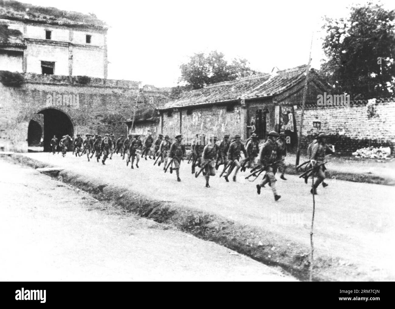 (140225) -- BEIJING, (Xinhua) -- File photo taken in 1937 shows Chinese troops running to Lugou Bridge to fight against Japanese aggressors. Chinese lawmakers are mulling making December 13 a national memorial day to commemorate those killed by Japanese aggressors during the Nanjing Massacre. The draft decision will be discussed at the bi-monthly session of the Standing Committee of the National People s Congress (NPC) which runs from Tuesday through Thursday. Japanese troops started the massacre in Nanjing on Dec. 13, 1937, killing more than 300,000 people in the following 40-odd days. (Xinhu Stock Photo