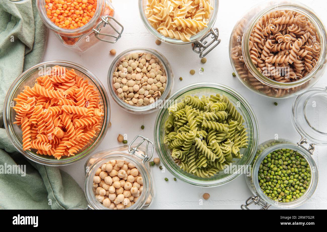 A variety of fusilli pasta made from different types of legumes, green and red lentils, mung beans and chickpeas. Gluten-free pasta. Stock Photo