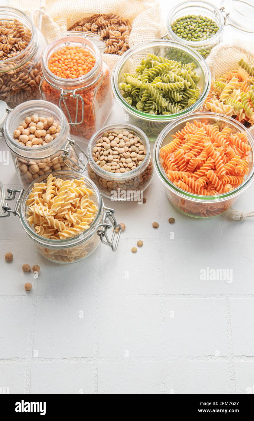 A variety of fusilli pasta made from different types of legumes, green and red lentils, mung beans and chickpeas. Gluten-free pasta. Stock Photo