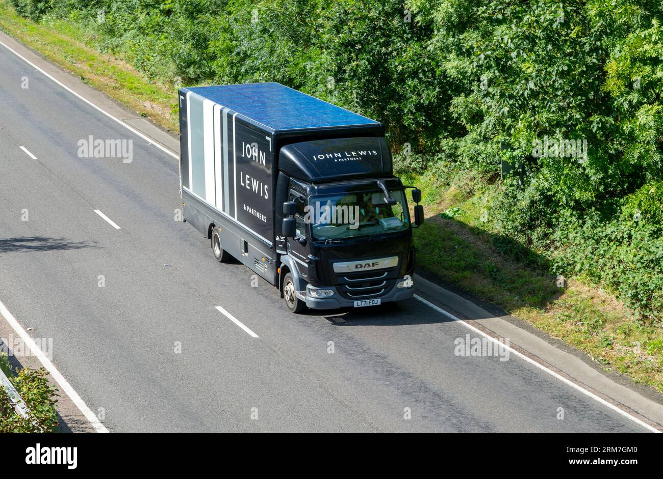DAF delivery vehicle operated by John Lewis on A12 near Wickham Market, Suffolk, England, UL Stock Photo
