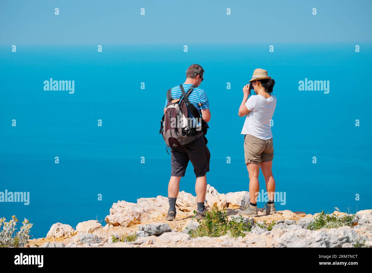 Two hikers standing on rocks hi-res stock photography and images - Alamy