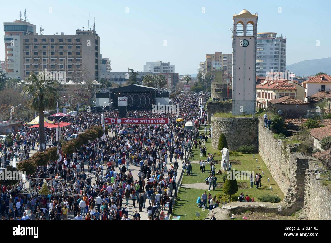 People gather outdoors in Elbasan, Albania, on March 14, 2014, in the celebration of the Summer Day, marking the end of winter, the rebirth of nature and a rejuvenation of spirit. The Summer Day s origin is at the Cermenika Fairy Sanctuary built in Shkumbin of Elbasan. She was the goddess of hunting, forests and all nature.(Xinhua/Liu Lihang) ALBANIA-ELBASAN-SUMMER DAY PUBLICATIONxNOTxINxCHN   Celebrities gather outdoors in Elbasan Albania ON March 14 2014 in The Celebration of The Summer Day marking The End of Winter The Rebirth of Nature and a Rejuvenation of Spirit The Summer Day S ORIGIN I Stock Photo