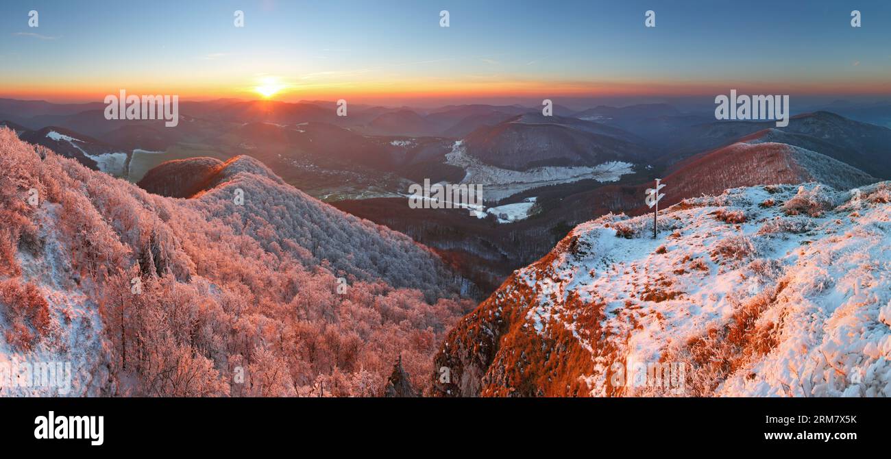 A frosty sunset panorama in beauty mountains from peak Strazov Stock Photo
