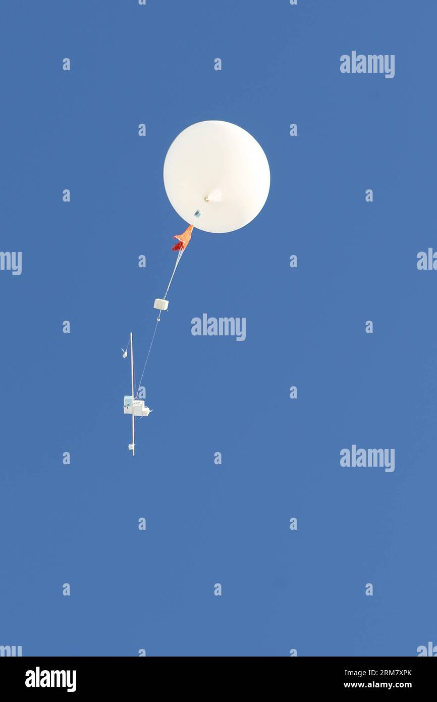 a sounding balloon is seen in the air in Sodankyla, Finland on March 18, 2014. In an effort to carefully monitor the ozone depletion in the Arctic area, the Arctic Research Center of Finnish Meteorological Institute, located in Sodankyla, northern Finland, has increased the frequency of launching sounding balloons. (Xinhua/Li Jizhi)(axy) ARCTIC-OZONE-SOUNDING BALLOON PUBLICATIONxNOTxINxCHN   a sounding Balloon IS Lakes in The Air in  Finland ON March 18 2014 in to effort to carefully Monitor The Ozone depletion in The Arctic Area The Arctic Research Center of Finnish Meteorological Institute L Stock Photo