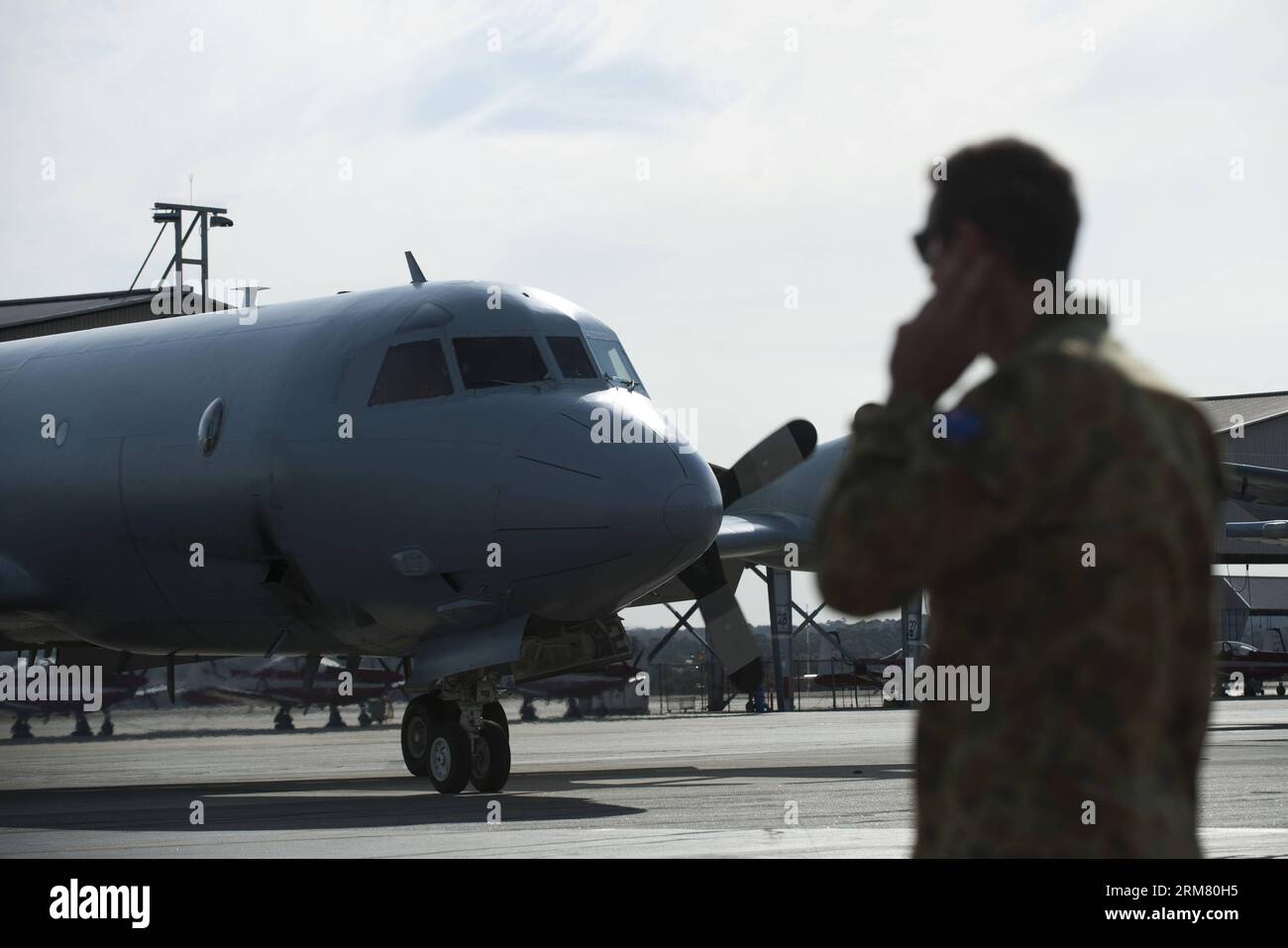 An Australian Airforce search plane returns to Pearce Air Force base after searching for missing Malaysia Airlines flight MH370, Australia, on March 22, 2014. The Australian Maritime Safety Authority (AMSA) said Saturday that so far no sightings have been reported, and that the current search area was identified based on satellite images provided by the Australia Geospatial-Intelligence Organization (AGO) and has been expanded to 36,000 square kilometers. (Xinhua/Lui Siu Wai) AUSTRALIA-PERTH-SEARCH-MISSING FLIGHTS PUBLICATIONxNOTxINxCHN   to Australian Airforce Search Plane Returns to Pearce A Stock Photo