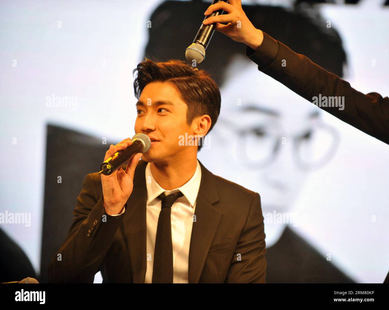(140322) -- BEIJING, March 22, 2014 (Xinhua) -- Member of Super Junior Lee Choi Siwon speaks during a new album release press conference in Beijing, capital of China, March 22, 2014. Press conference of Super Junior s new album SWING is held here on Saturday. (Xinhua/Cheng Tingting) (cjq) CHINA-BEIJING-SUPER JUNIOR-ALBUM RELEASE (CN) PUBLICATIONxNOTxINxCHN   Beijing March 22 2014 XINHUA member of Super Junior Lee Choi  Speaks during a New Album Release Press Conference in Beijing Capital of China March 22 2014 Press Conference of Super Junior S New Album Swing IS Hero Here ON Saturday XINHUA C Stock Photo