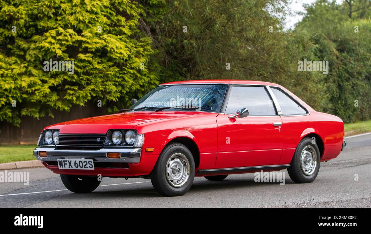 Whittlebury,Northants,UK -Aug 26th 2023: 1978 red Toyota Celica car travelling on an English country road Stock Photo