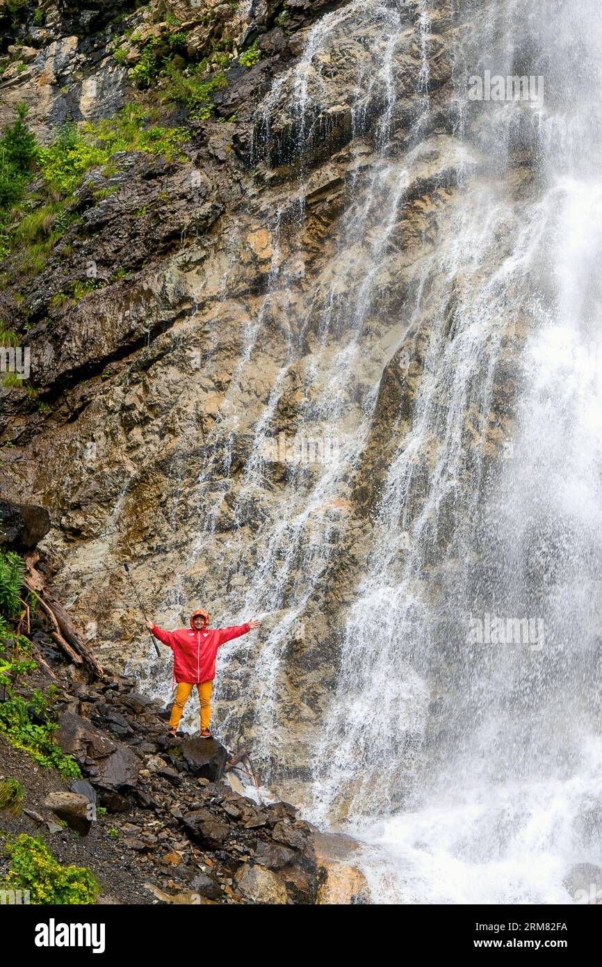 Man standing under waterfall hires stock photography and images Alamy