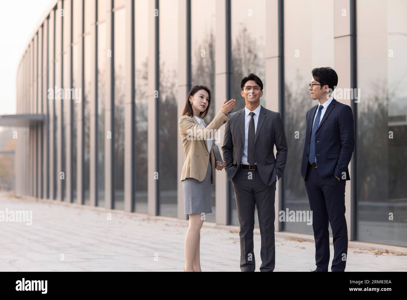 Business people talking outdoors Stock Photo - Alamy