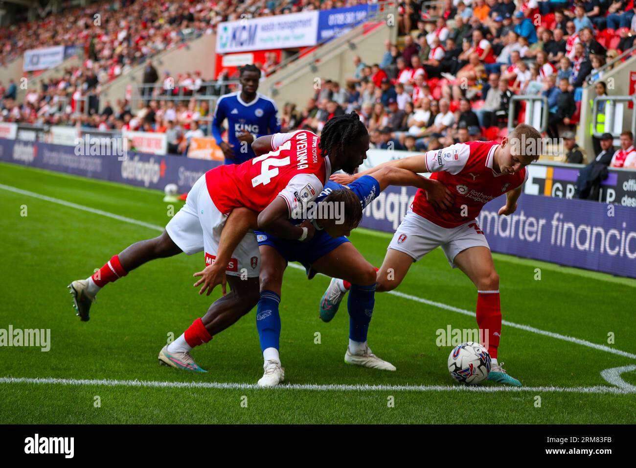 AESSEAL New York Stadium, Rotherham, England - 26th August 2023 Callum Doyle (5) of Leicester City shields the ball from Fred Onyedinma (14) of Rotherham United and Ciaran McGuckin (35) of Rotherham United - during the game Rotherham United v Leicester City, Sky Bet Championship,  2023/24, AESSEAL New York Stadium, Rotherham, England - 26th August 2023 Credit: Mathew Marsden/WhiteRosePhotos/Alamy Live News Stock Photo