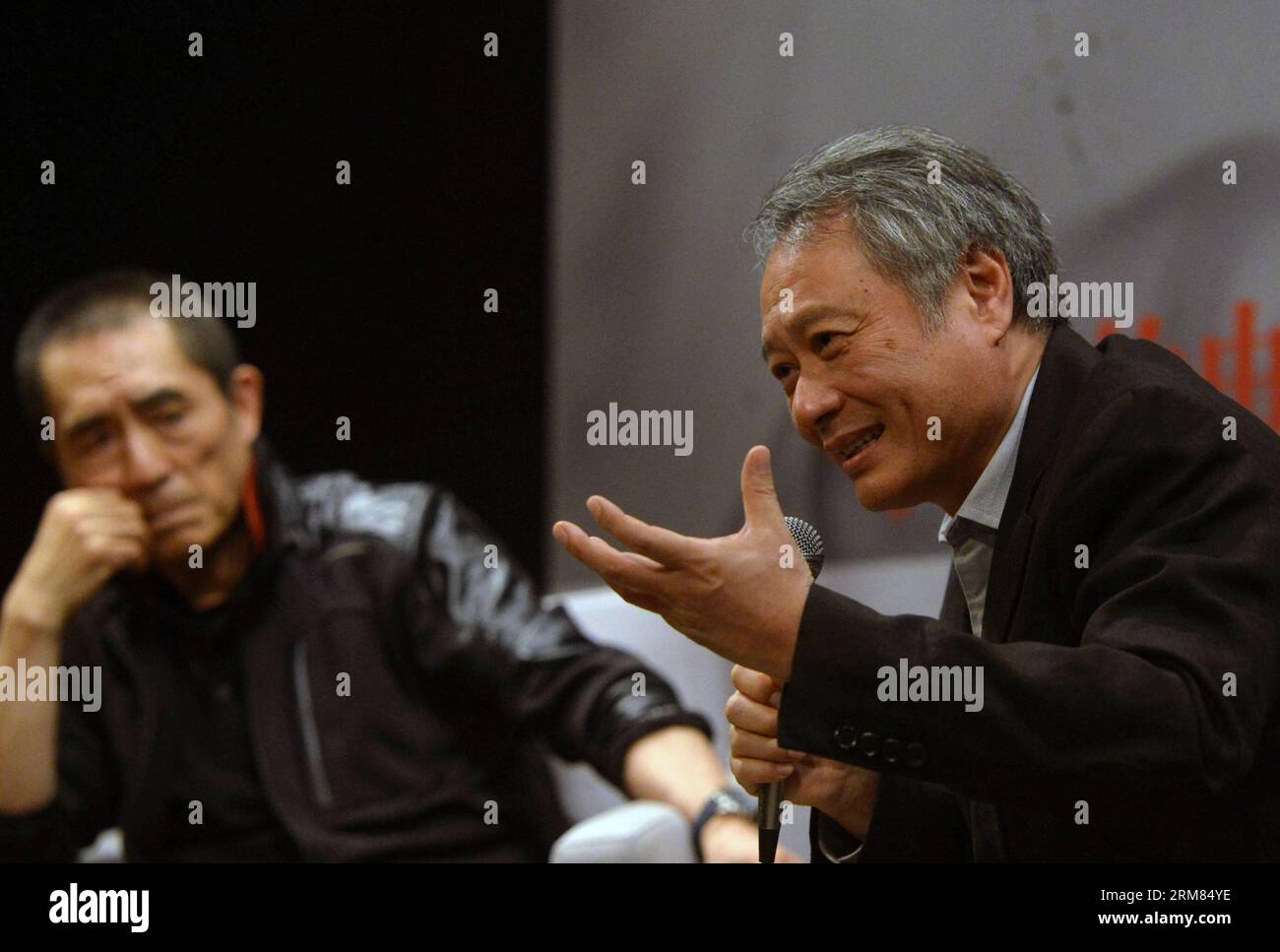 NEW YORK, March 27, 2014 (Xinhua) -- Two-time Oscar-winning director Ang Lee (R) and renowned film director Zhang Yimou attend a dialog in New York, the United States, March 27, 2014. The two film directors on Thursday held a dialog about Chinese film culture and Zhang s new movie Coming Home . (Xinhua/Wang Lei) (lyx) U.S.-NEW YORK-FILM DIRECTORS-ZHANG YIMOU-ANG LEE-DIALOGUE PUBLICATIONxNOTxINxCHN   New York March 27 2014 XINHUA Two Time Oscar Winning Director Ang Lee r and renowned Film Director Zhang Yimou attend a Dialogue in New York The United States March 27 2014 The Two Film Directors O Stock Photo