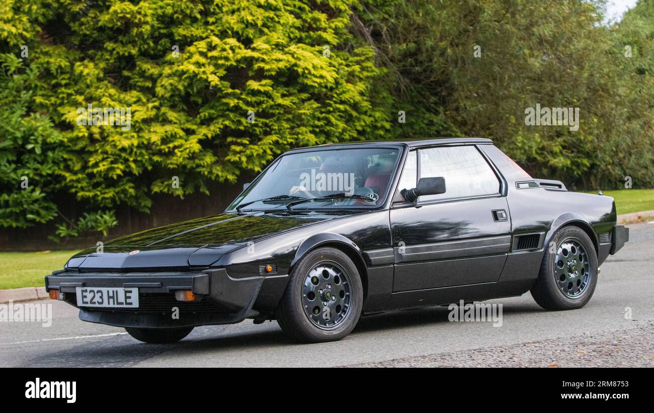 Whittlebury,Northants,UK -Aug 26th 2023: 1987 black Fiat X19 car travelling on an English country road Stock Photo