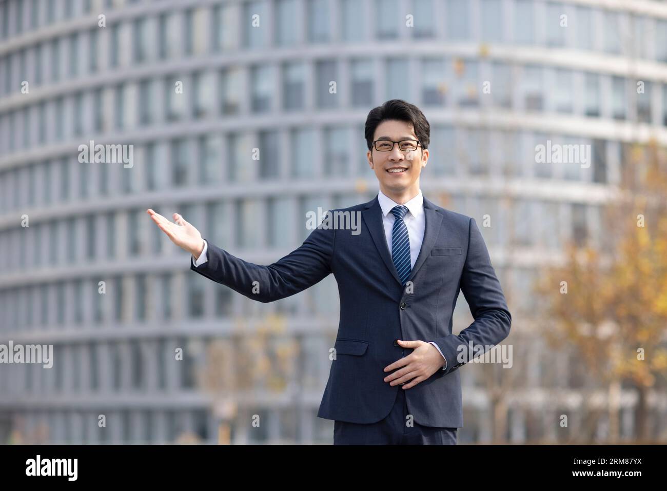 Confident businessman greeting outdoors Stock Photo - Alamy