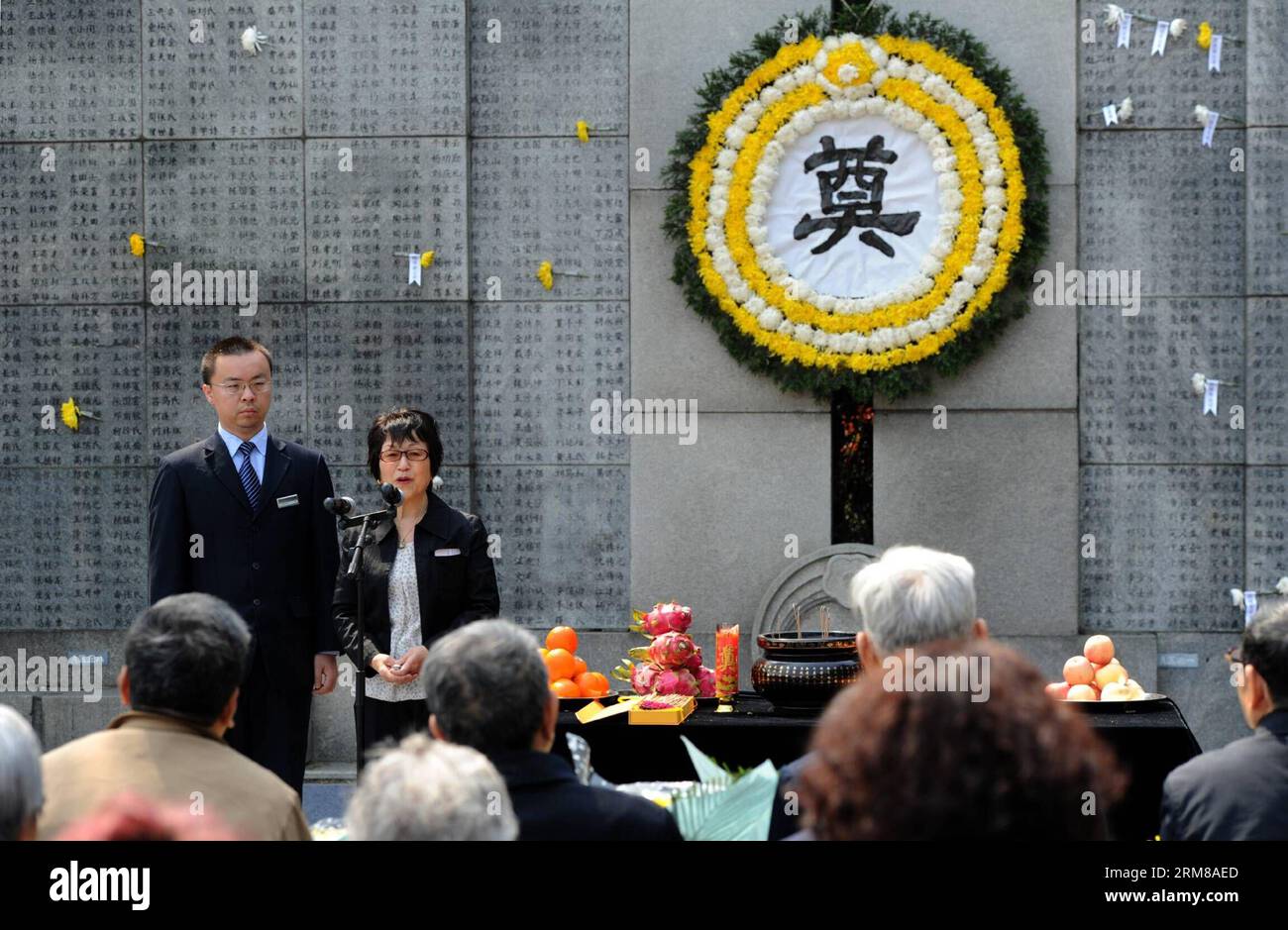 (140405) -- NANJING, April 5, 2014 (Xinhua) -- A Japanese woman (R) attends a memorial ceremony in the Memorial Hall of the Victims in Nanjing Massacre by Japanese Invaders, in Nanjing, capital of east China s Jiangsu Province, April 5, 2014, also the Qingming Festival, or the Tomb-Sweeping Day. Lots of citizens came here to mourn Nanjing Massacre victims on Saturday. (Xinhua/Han Yuqing) (wf) CHINA-NANJING-QINGMING FESTIVAL-NANJING MASSACRE-MEMORIAL CEREMONY (CN) PUBLICATIONxNOTxINxCHN   Nanjing April 5 2014 XINHUA a Japanese Woman r Attends a Memorial Ceremony in The Memorial Hall of The Vict Stock Photo