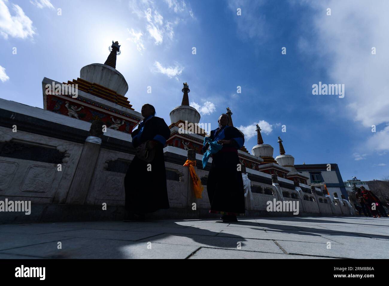 (140406) -- HUANGZHONG COUNTY, April 6, 2014 (Xinhua) -- Two Tibetan Buddhists worship in the Kumbum Monastery in Huangzhong County of Xining, capital of northwest China s Qinghai Province, April 6, 2014. The Kumbum Monastery is a main destination for Tibetan Buddhist pilgrims. It is also a major tourist attraction in Qinghai, which features splendid religious murals, Thangka appliques and butter sculptures. (Xinhua/Wu Gang) (lmm) CHINA-QINGHAI-KUMBUM MONASTERY-TOURISM (CN) PUBLICATIONxNOTxINxCHN   Huang Zhong County April 6 2014 XINHUA Two Tibetan Buddhists Worship in The Kumbum monastery in Stock Photo