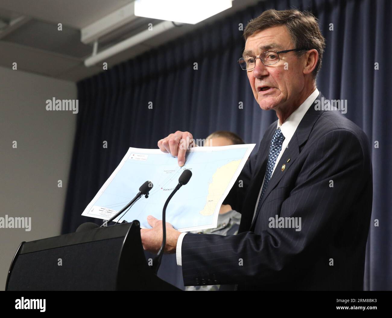 (140407) -- PERTH, April 7, 2014 (Xinhua) -- Angus Houston, head of the Joint Agency Coordination Center (JACC) for the searching of the missing Malaysian flight MH370 speaks during a news conference in Perth, Australia, on April 7, 2014. An Australian vessel searching the missing Malaysian flight 370 has detected electronic pulse signals probably related to the black box in the Indian Ocean during the past 24 hours. However, the unsuccessful effort to reacquire the signal later may suggest the battery may finish in a very short time, according to searching officials and U.S. Navy technicians. Stock Photo