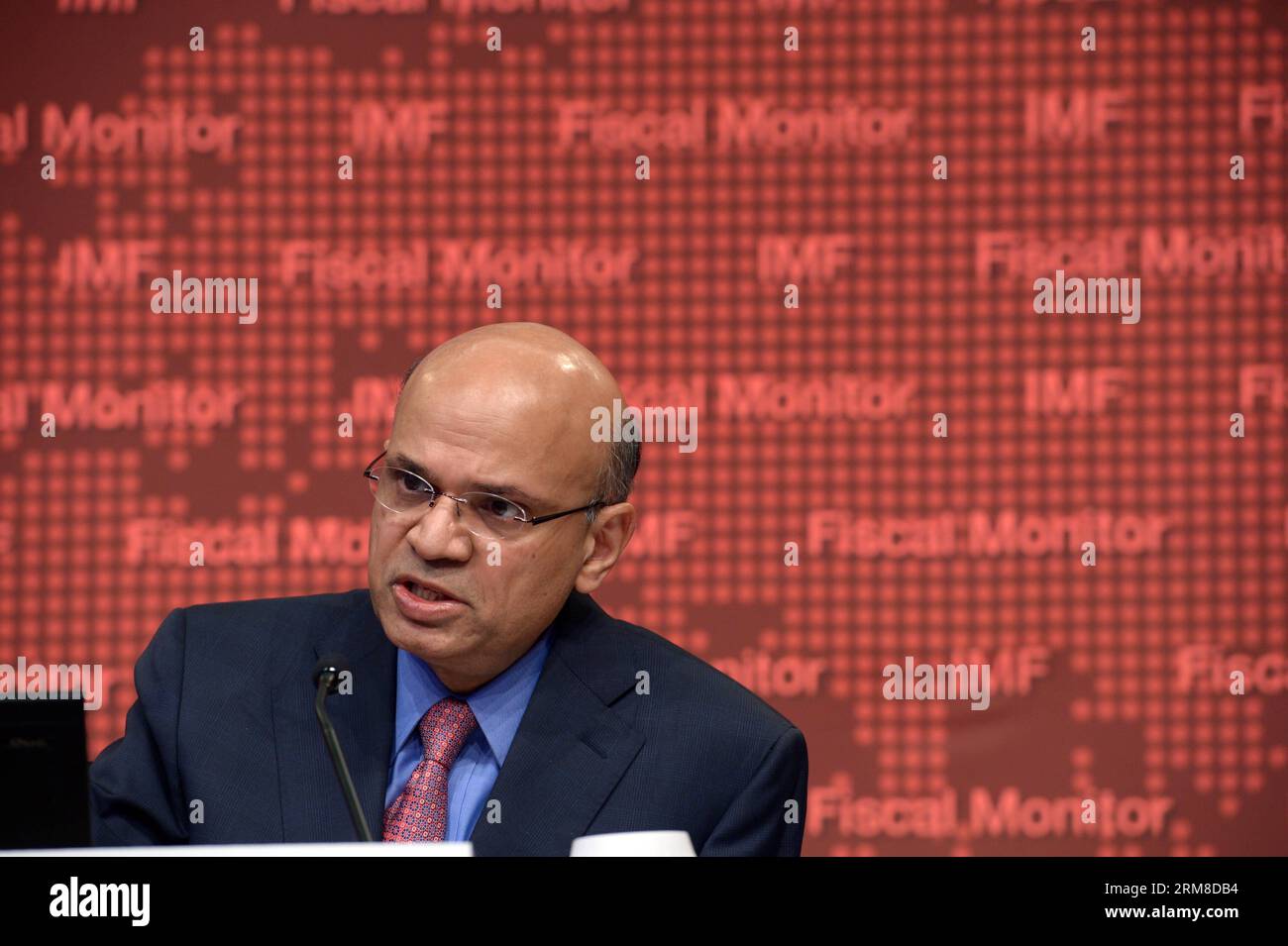 140409 -- WASHINGTON D.C., April 9, 2014 Xinhua -- Sanjeev Gupta, acting director of the Fiscal Affairs Department of the International Monetary Fund IMF, speaks at a press conference releasing the Global Financial Stability Report in Washington D.C., the United States, April 9, 2014. Global fiscal risks are abating somewhat but remain elevated, and underlying fiscal vulnerabilities have increased in emerging market economies during the past year, said the IMF on Wednesday in the newly-released report. Xinhua/Yin Bogu US-IMF-FISCAL MONITOR REPORT PUBLICATIONxNOTxINxCHN Stock Photo