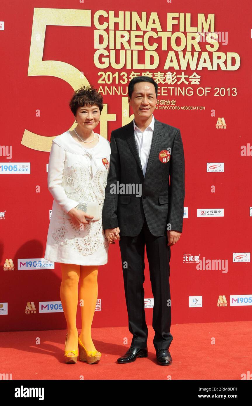 BEIJING,   Actor Feng Yuanzheng and his wife Liang Danni, an actress, take part in the 2013 annual commendation conference of China Film Directors Guild in Beijing, capital of China, April 9, 2014. (Xinhua) (zwy) CHINA-BEIJING-COMMENDATION CONFERENCE-CHINA FILM DIRECTORS GUILD(CN) PUBLICATIONxNOTxINxCHN   Beijing Actor Feng  and His wife Liang Danni to actress Take Part in The 2013 Annual  Conference of China Film Directors Guild in Beijing Capital of China April 9 2014 XINHUA  China Beijing  Conference China Film Directors Guild CN PUBLICATIONxNOTxINxCHN Stock Photo