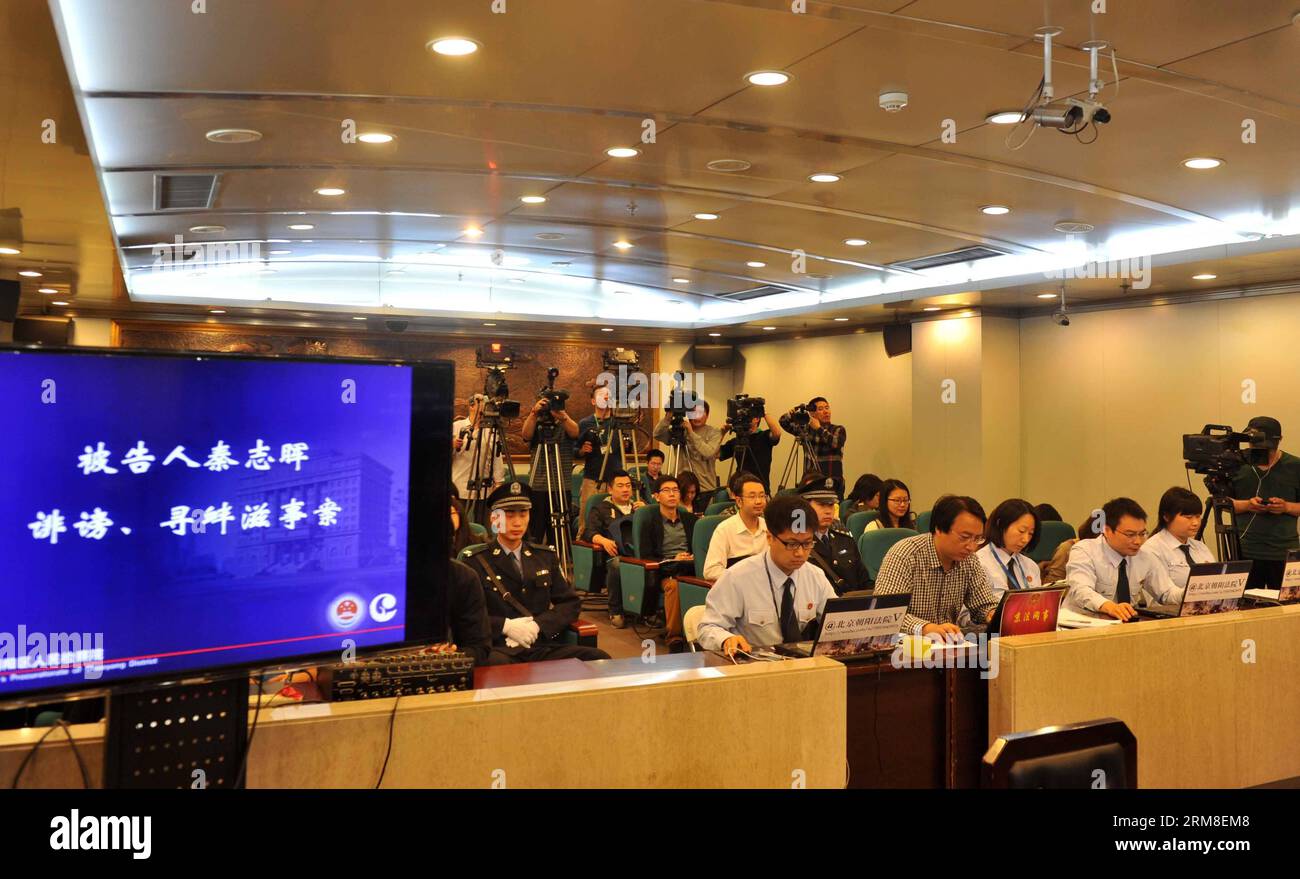 (140411) -- BEIJING, April 11, 2014 (Xinhua) -- Reporters work before the trail of Qin Zhijun, An alleged rumormonger, at the Chaoyang District People s Court in Beijing, capital of China, April 11, 2014. Qin Zhihui, known as Qinhuohuo in cyberspace, was accused of creating and spreading rumors about several Chinese celebrities including popular TV hostess Yang Lan, as well as China s former Ministry of Railways, via Sina Weibo, China s Twitter-like service, from December 2012 to August 2013, according to prosecutors. (Xinhua/Gong Lei) (lfj) CHINA-BEIJING-ALLEGED RUMORMONGER-TRIAL (CN) PUBLICA Stock Photo