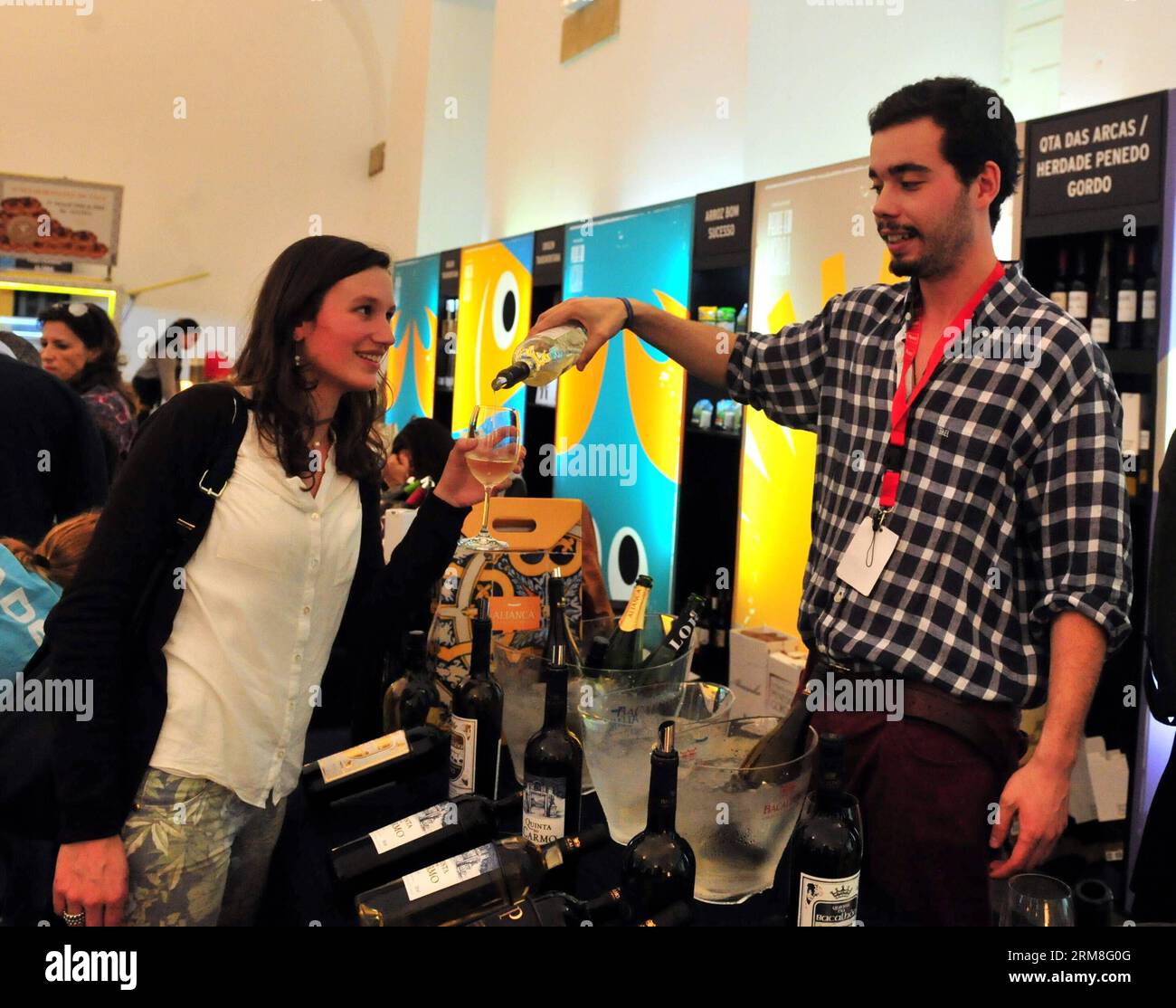 A visitor tastes Portuguese wine during the Lisbon Fish and Flavours Festival in Lisbon, Portugal, on April 12, 2014. The festival is held from April 3 to April 13. (Xinhua/Zhang Liyun) PORTUGAL-LISBON-FISH AND FLAVOURS-FESTIVAL PUBLICATIONxNOTxINxCHN   a Visitor Tastes PORTUGUESE Wine during The Lisbon Fish and Lambkin flavors Festival in Lisbon Portugal ON April 12 2014 The Festival IS Hero from April 3 to April 13 XINHUA Zhang Liyun Portugal Lisbon Fish and Lambkin flavors Festival PUBLICATIONxNOTxINxCHN Stock Photo
