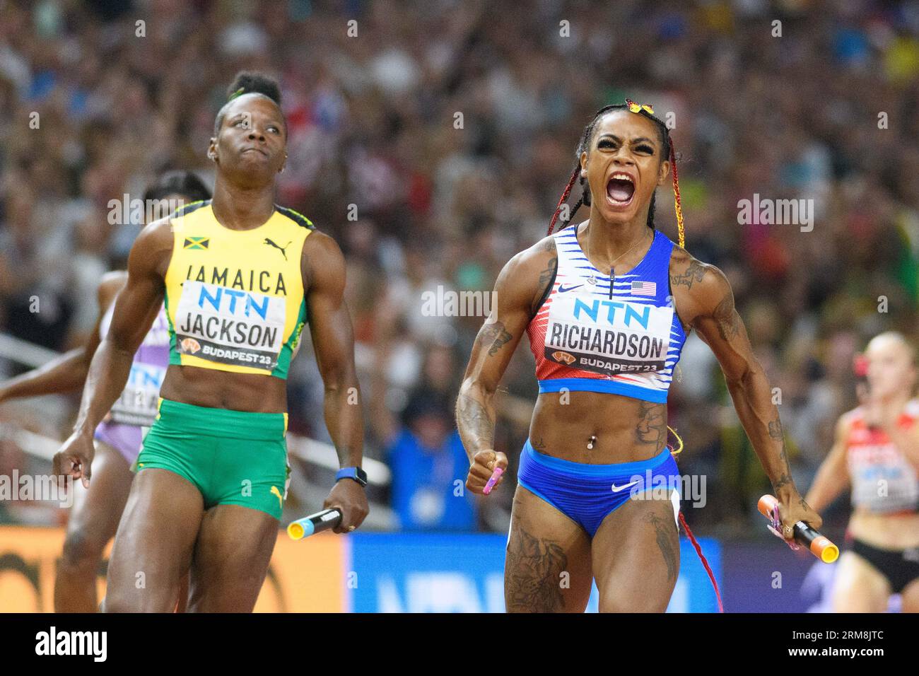 ShaCarrie Richardson (USA) celebrating while crossing the finish line