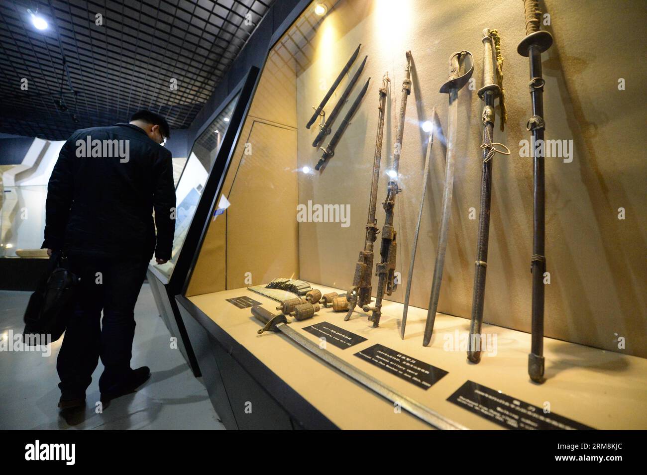 (140418) -- HARBIN, April 18, 2014 (Xinhua) -- A man looks at weapons used by Japanese invaders at a museum on Unit 731 in Harbin, capital of northeast China s Heilongjiang Province, April 18, 2014. Unit 731 was a Harbin-based biological and chemical warfare research unit of the Japanese army during WWII. The Unit 731 facility ruins in Harbin are evidences of the wartime atrocities committed by Japanese invaders in China. Unit 731 members conducted a series of human experiments which subjected victims to vivisections, germ war attacks, weapon tests and other forms of torture. April 18 is the I Stock Photo