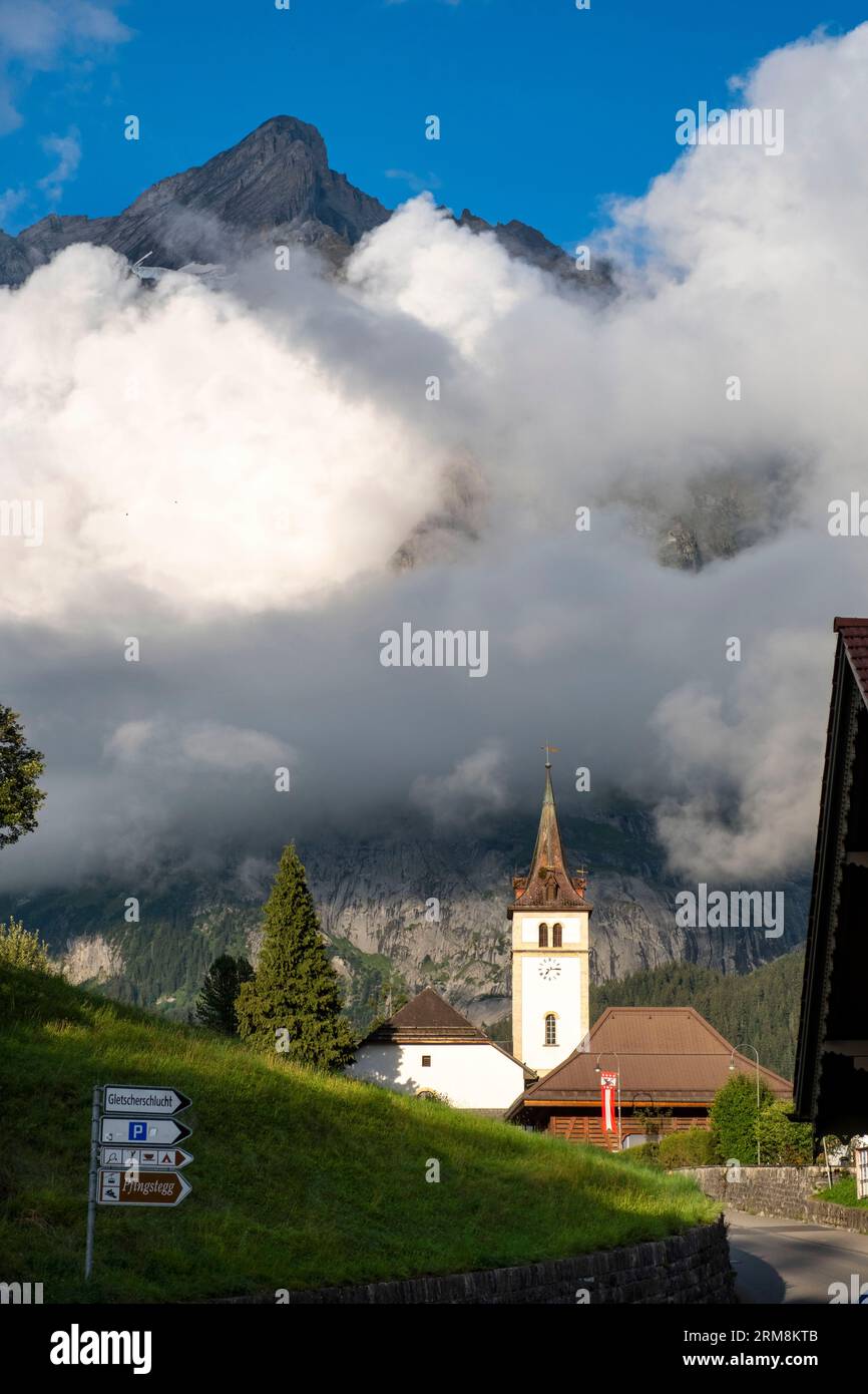 Grindelwald church with the Wetterhorn mountain behind, Bernese Alps, Grindelwald, Canton of Bern, Switzerland. Stock Photo