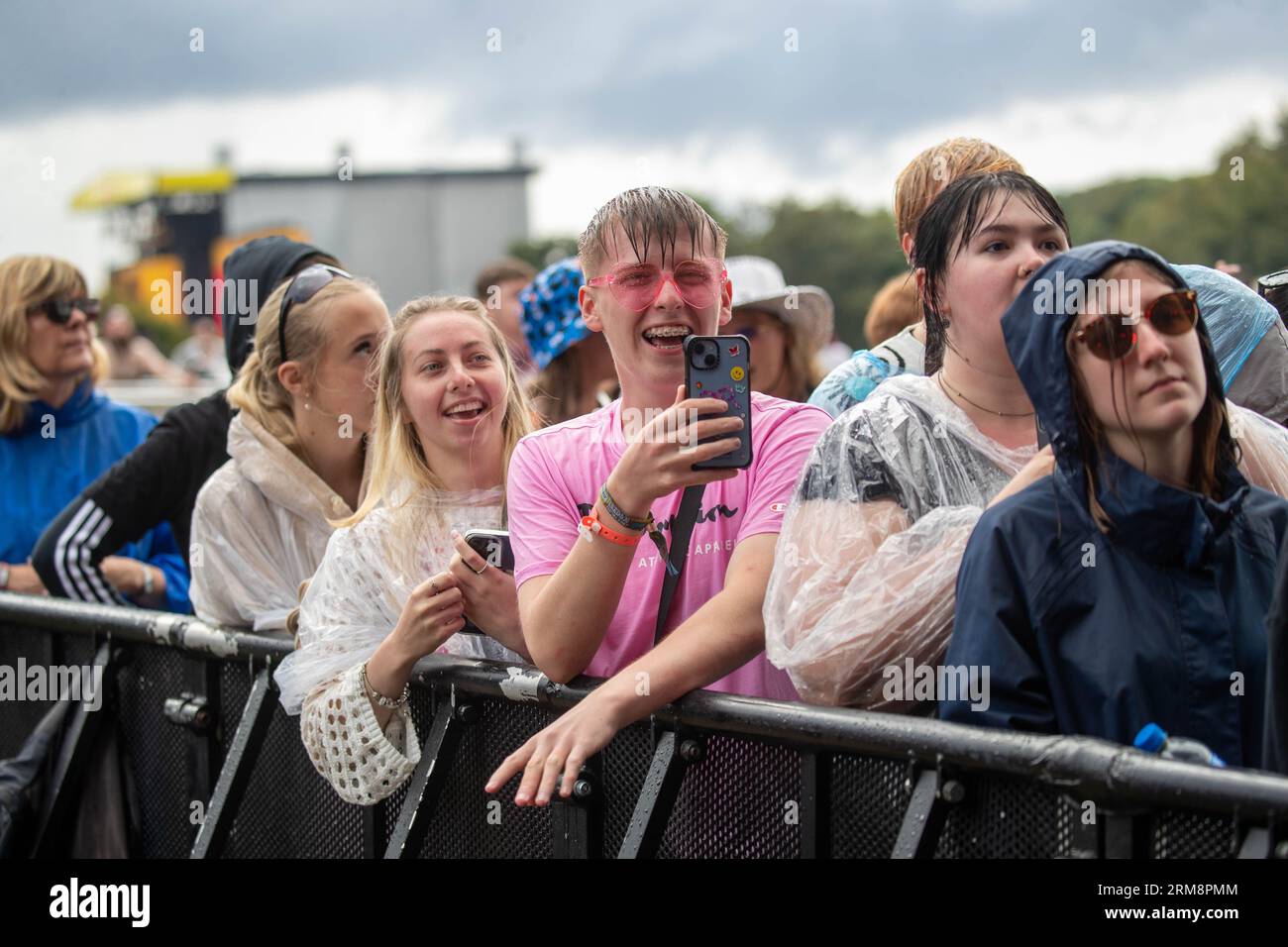 Leeds, UK. Sunday 27 August 2023 Attendees braving the torrential rain