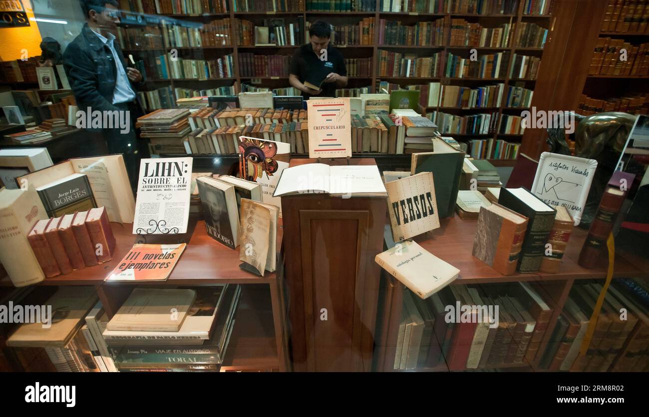 SANTIAGO, April 23, 2014 (Xinhua) -- People visit a bookstore specialized in old books in the city of Santiago, capital of Chile, on April 23, 2014. The World Book Day is commemorated on Wednesday, aiming to promote reading, and boost the editorial industry and the protection of the intellectual property by copyrights. (Xinhua/Jorge Villegas)(ctt) CHILE-SANTIAGO-CULTURE-BOOK DAY PUBLICATIONxNOTxINxCHN   Santiago April 23 2014 XINHUA Celebrities Visit a Bookstore SPECIALIZED in Old Books in The City of Santiago Capital of Chile ON April 23 2014 The World Book Day IS commemorated ON Wednesday ai Stock Photo
