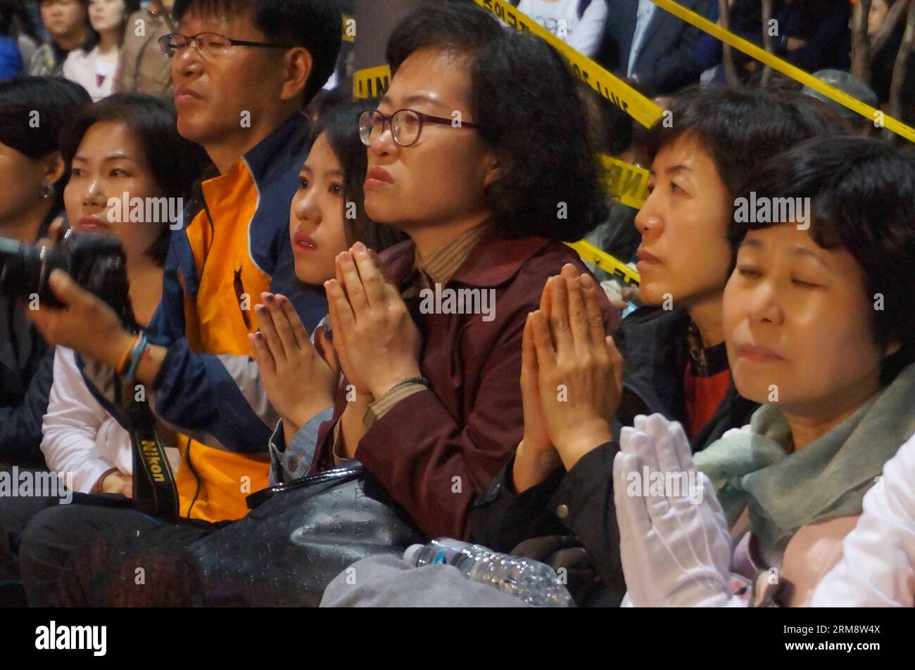 (140427) -- SEOUL, April 26, 2014 (Xinhua) -- People pray for the deceased and missing passengers of the capsized ship Sewol during the Lotus Lantern Festival for upcoming birthday of Buddha in Seoul, South Korea, April 26, 2014. (Xinhua/Du Baiyu) (dzl) SOUTH KOREA-SEOUL-SEWOL-PRAY PUBLICATIONxNOTxINxCHN   Seoul April 26 2014 XINHUA Celebrities Pray for The deceased and Missing Passengers of The capsized Ship  during The Lotus Lantern Festival for upcoming Birthday of Buddha in Seoul South Korea April 26 2014 XINHUA you Baiyu dzl South Korea Seoul  Pray PUBLICATIONxNOTxINxCHN Stock Photo