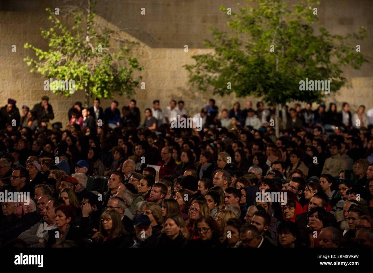People attend the annual ceremony marking Holocaust Remembrance Day at ...