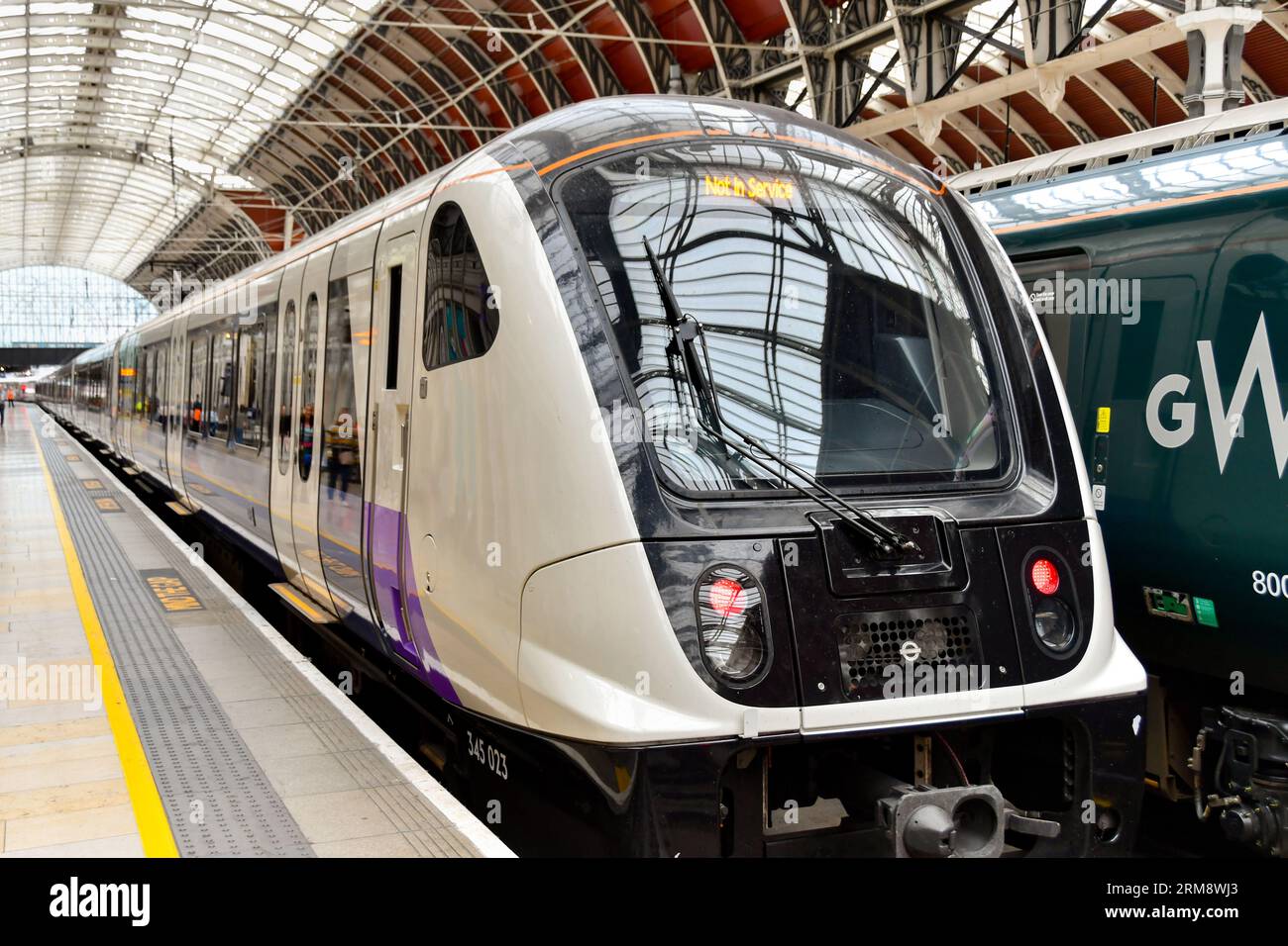 London, England, UK - 28 June 2023: New commuter train on the Elizabeth Line stopped at London Paddington railway station Stock Photo