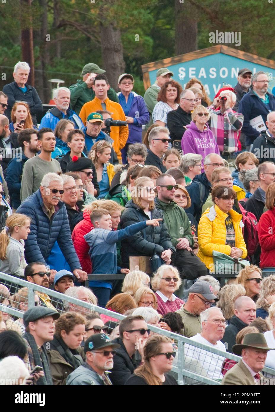 Crowds of spectators watching field competitions at the Braemar Highland Games. Aberdeenshire, Scotland Stock Photo