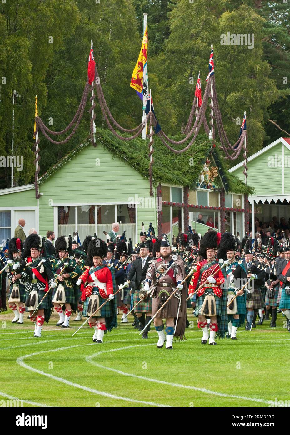 Scottish Massed Pipe Bands marching past the Royal Box at the 'The Braemar Gathering', Highland Games Stock Photo