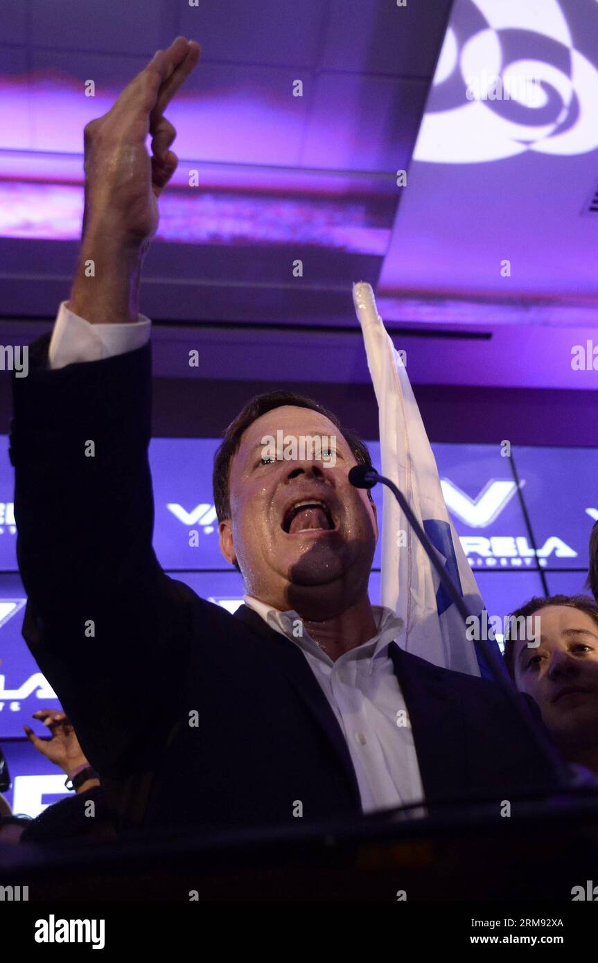 PANAMA CITY, May 4, 2014 (Xinhua) -- Presidential candidate Juan Carlos Varela(C) from the Panamenista Party gives a speech after the preliminary results of the general elections, in Panama City, capital of Panama, on May 4, 2014. President of the Supreme Electoral Court Erasmo Pinilla said on Sunday night that Juan Carlos Varela is the virtual winner of Panama s presidency.(Xinhua/Mauricio Valenzuela) PANAMA-PANAMA CITY-POLITICS-ELECTIONS PUBLICATIONxNOTxINxCHN   Panama City May 4 2014 XINHUA Presidential Candidate Juan Carlos Varela C from The  Party Gives a Speech After The preliminary Resu Stock Photo
